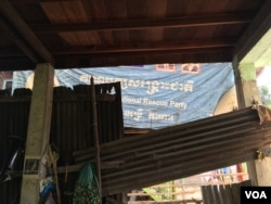 After the opposition party was dissolved, Keo Eat was ordered by police to take down from his home all the banners bearing its logo. He complied but turned one inward as a gesture of defiance, November 27, 2017. (Julia Wallace/VOA Khmer)