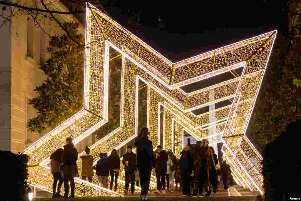 People walk under New Year and Christmas decorations in Podgorica, Montenegro.