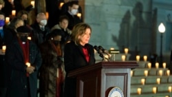 House Speaker Nancy Pelosi leads members of the House and the Senate in observing a moment of silence during a vigil to commemorating the anniversary of the deadly attack on the U.S. Capitol, Jan. 6, 2022, in Washington.