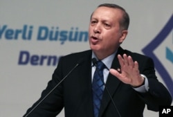 FILE - Turkey's President Recep Tayyip Erdogan addresses his supporters in Ankara, Turkey, Thursday, May 12, 2016.