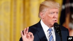 FILE - President Donald Trump speaks in the East Room of the White House in Washington, Aug. 1, 2017.