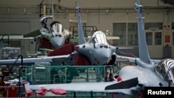 FILE - View of the assembly line of the Rafale fighter jet in the factory of French aircraft manufacturer Dassault Aviation in Merignac near Bordeaux, southwestern France, Jan. 10, 2014.