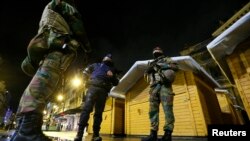 Belgian soldiers patrol in central Brussels after the alert status was raised to its highest level because of a "serious and imminent" threat of a terrorist attack, Nov. 21, 2015.