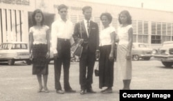 Tun Sovan, center, stands with his mother, two sisters and a brother in law. The photo was taken in front of Pochentong International Airport in 1962, before leaving to the United States. (Photo courtesy of Tun Sovan)