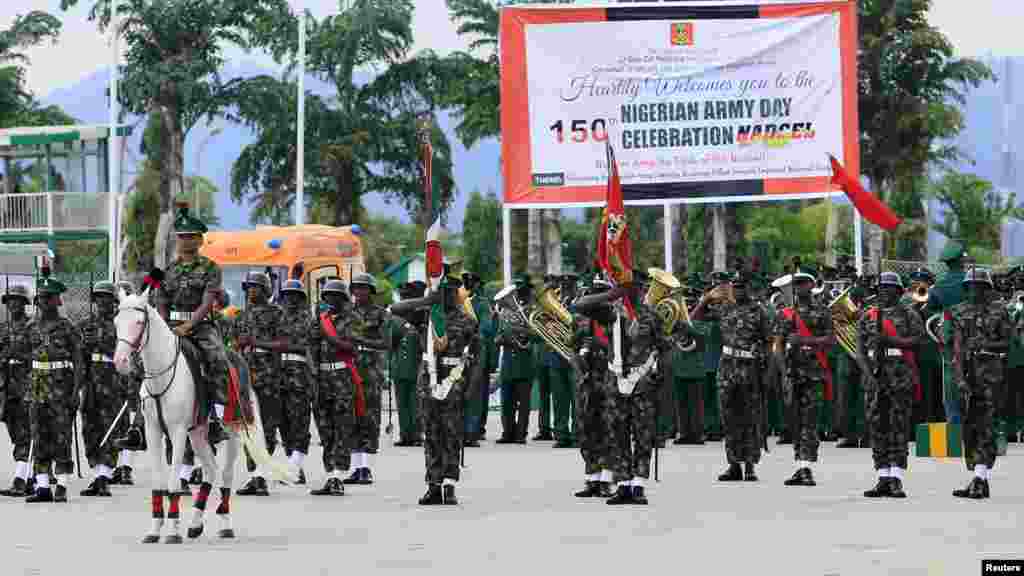 Soldiers take part in a parade for the Nigeria Army's 150th anniversary celebration in Abuja.