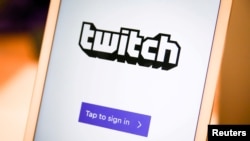 FILE - A Twitch sign-in screen is seen at the offices of Twitch Interactive Inc., a social video platform and gaming community owned by Amazon, in San Francisco, March 6, 2017.