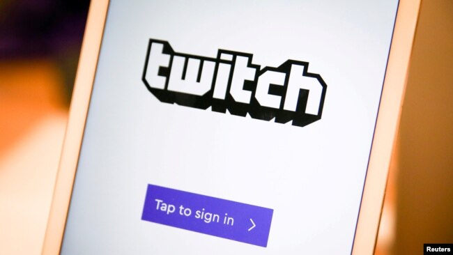 FILE - A Twitch sign-in screen is seen at the offices of Twitch Interactive Inc., a social video platform and gaming community owned by Amazon, in San Francisco, March 6, 2017.