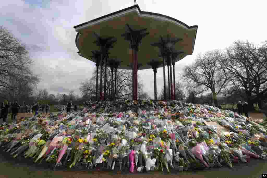 Floral tributes and candles placed at the bandstand on Clapham Common in London in honor of Sarah Everard. The slaying of Everard sent shockwaves across the U.K. because a Metropolitan Police officer is charged with her kidnapping and murder.