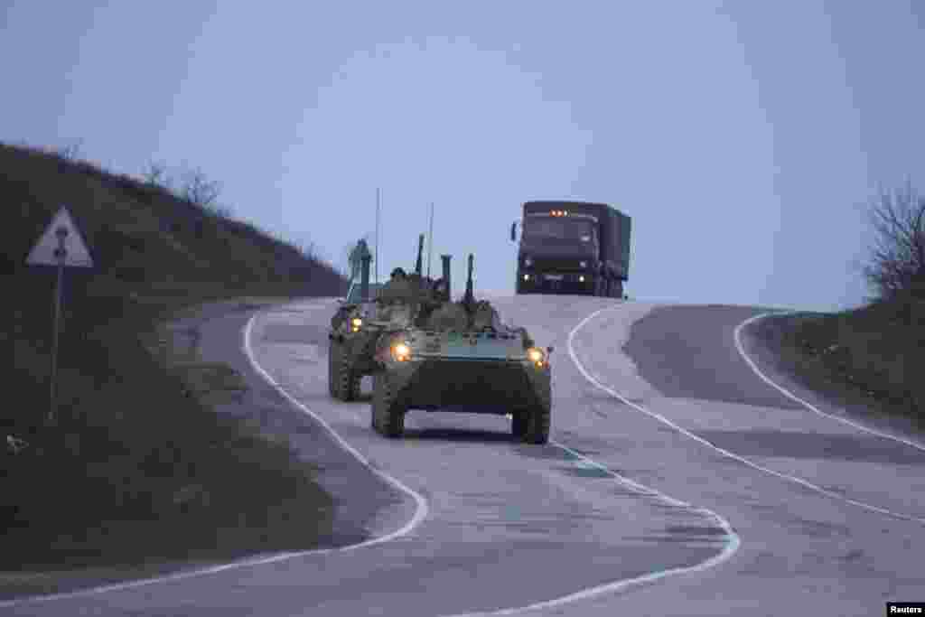 Russian military armored personnel carriers drive from Sevastopol to Simferopol, Crimea, Ukraine, March 4, 2014.