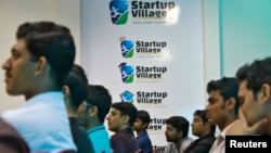 FILE - Entrepreneurs, employees and students listen to a speech during the Start-up saturday event at the Start-up Village in Kinfra High Tech Park in the southern Indian city of Kochi.