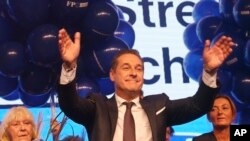 Hans-Christian Strache, leader of the strongly eurosceptic Austrian Freedom Party, waves to his supporters in Vienna, Austria, Sunday, Oct. 15, 2017, after the closing of the polling stations for the Austrian national elections. 