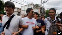 FILE - Student activists gather outside Pathumwan Police Station in Bangkok, Thailand, June 24, 2015.