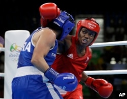 Britain's Nicola Adams, right, fights France's Sarah Ourahmoune during a women's flyweight 51-kg final boxing match at the 2016 Summer Olympics in Rio de Janeiro, Brazil, Aug. 20, 2016.