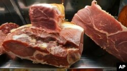 Prosciutto and other meat imported from Italy are seen at a delicatessen in Arlington, Va.