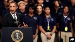 President Barack Obama speaks about strengthening the economy for the middle class and the nation's struggle with gun violence, at an appearance at Hyde Park Academy, in Chicago, Feb. 15, 2013.