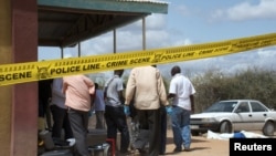 Kenyan security forces secure the African Inland Church after an attack in Kenya's northern town of Garissa, July 1, 2012. 