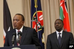 FILE - Kenya's President Uhuru Kenyatta (L) accompanied by Deputy President William Ruto, right, speaks to the media at State House in Nairobi, Kenya, Sept. 21, 2017.