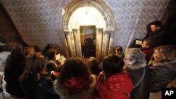 Catholic pilgrims pray at the entrance of the Grotto at the Church of Nativity, traditionally believed by Christians to be the birthplace of Jesus Christ, in the West Bank town of Bethlehem (file photo)