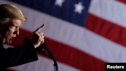 U.S. President Donald Trump addresses a campaign rally at the Columbia Regional Airport in Columbia, Mo., Nov. 1, 2018.