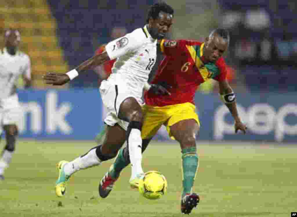 Ghana's Tagoe Prince (L) challenges Zayatte Kamil of Guinea during their African Cup of Nations Group D soccer match at Franceville stadium February 1, 2012.