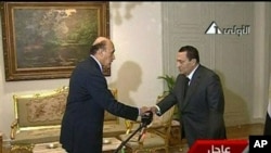 In this image taken from TV, Egyptian President Hosni Mubarak, right, shakes the hand of Omar Suleiman, who was sworn in as Vice President of Egypt, Jan 29, 2011