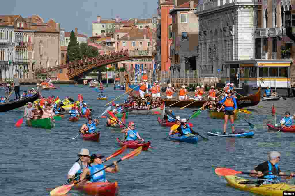 Rowers arrive in the Grand Canal to take part in the Vogalonga, or Long Row, regatta in the Venetian Lagoon, in Venice, Italy.