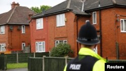 A policeman stands outside a residential property in south Manchester, Britain, May 24, 2017. 