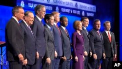 From left, John Kasich, Mike Huckabee, Jeb Bush, Marco Rubio, Donald Trump, Ben Carson, Carly Fiorina, Ted Cruz, Chris Christie and Rand Paul take the stage during the CNBC Republican presidential debate in Boulder, Colo., Oct. 28, 2015.