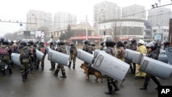 Riot police gather to block demonstrators during a protest in Almaty, Kazakhstan, Jan. 5, 2022. 