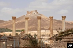 This photo released on Sunday March 27, 2016, by the Syrian official news agency SANA, shows a general view of Palmyra citadel, central Syria.