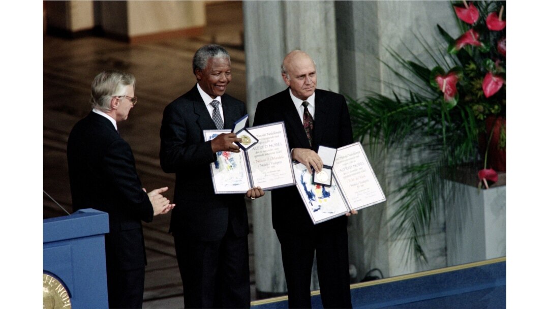 FILE - In this Dec. 09, 1993 photo, Nelson Mandela, president of South African African National Congress (C) and South African President Frederik de Klerk display in Oslo their Nobel Prizes for their work to end apartheid.