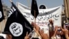 FILE - Demonstrators chant pro-al-Qaida-inspired Islamic State statements as they wave al-Qaida flags in front of the provincial government headquarters in Mosul, Iraq, June 16, 2014.