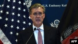 FILE - Richard Olson, who was then the U.S. special representative for Afghanistan and Pakistan, speaks during a press conference at the U.S. Embassy in Kabul, Dec. 6, 2015.