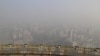A view from a viewing deck on the China Central Radio and Television Tower shows the city of Beijing in heavy smog, China, November 29, 2015. Heavy smog continues in Beijing on Sunday after a yellow alert of air pollution was issued on Friday, local media reported.