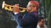Terence Blanchard, foreground, and Herbie Hancock perform at a sunrise concert marking International Jazz Day in New Orleans, April 30, 2012.