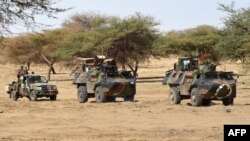 FILE - French soldiers involved in the regional anti-insurgent Operation Barkhane patrol in Timbamogoye, Mali, March 10, 2016. A French airstrike killed at least six suspected members of a jihadist group, a military spokesman said Dec. 20, 2018.