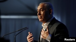 Israel's Prime Minister Benjamin Netanyahu delivers a speech during a cornerstone laying ceremony for a new hospital in the port city of Ashdod, November 8, 2012.