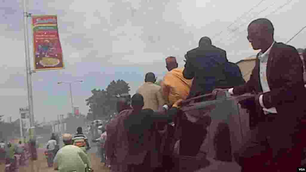 Security personnel on vehicle carrying Al-Mustapha as he arrives in Kano.