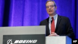 Mike Sinnett, Boeing's Vice President of Product Strategy, talks to reporters, March 27, 2019, about software and training updates for their 737 MAX 8 airplane in Renton, Washington.