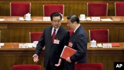 Chinese President Hu Jintao, left, chats with Vice President Xi Jinping as they leave the Great Hall of the People (file photo)