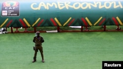 A security officer stands guard at the Olembe Stadium, which is to host the opening ceremony of the Africa Cup of Nations (AFCON), amid the coronavirus disease (COVID-19) pandemic, in Yaounde, Cameroon, Jan. 8, 2022.