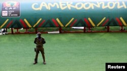 A security officer stands guard at the Olembe Stadium, which is to host the opening ceremony of the Africa Cup of Nations (AFCON), amid the coronavirus disease (COVID-19) pandemic, in Yaounde, Cameroon, Jan. 8, 2022.