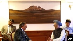 U.S. Secretary of Defense Leon Panetta, second left, speaks with Indian Prime Minister Manmohan Singh during a meeting at the Prime Minister's office in New Delhi, India, June 5, 2012. 