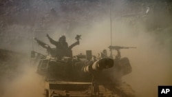 Israeli soldiers participate in a military exercise in the Israeli-controlled part of the Golan Heights, Sept. 19, 2012.