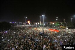 People demonstrate outside Ataturk international airport during an attempted coup in Istanbul, Turkey, July 16, 2016.