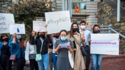 Thai protesters read statements during a demonstration in front of the Royal Thai Embassy in Washington, DC. Tuesday, Oct 20, 2020.