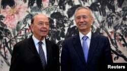 U.S. Commerce Secretary Wilbur Ross, left, chats with Chinese Vice Premier Liu He during a photograph session after their meeting at the Diaoyutai State Guesthouse in Beijing, China, June 3, 2018.