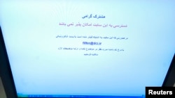 A Farsi text alerts on a computer screen alerts an Internet user trying to log onto social networking site Facebook in Tehran that access to this site is not possible, May 25, 2009 photo.