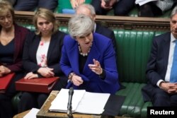 Britain's Prime Minister Theresa May speaks during PMQ session in Parliament, in London, Britain, Jan. 30, 2019.