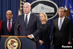 Acting Attorney General Matthew Whitaker, Commerce Secretary Wilbur Ross, from left, Homeland Security Secretary Kirstjen Nielsen and FBI Director Christopher Wray hold a news conference to announce indictments against China's Huawei Technologies Co Ltd,